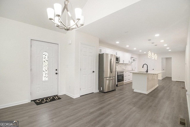 523 Mount Zion, Hapeville, GA 30354 - entrance foyer with a chandelier, dark wood finished floors, recessed lighting, and baseboards