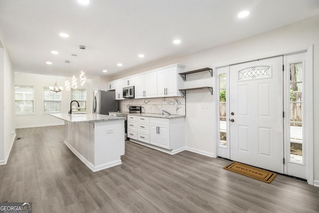523 Mount Zion, Hapeville, GA 30354 - kitchen with appliances with stainless steel finishes, a sink, a chandelier, white cabinetry, and recessed lighting