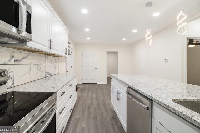 523 Mount Zion, Hapeville, GA 30354 - kitchen featuring appliances with stainless steel finishes, tasteful backsplash, recessed lighting, wood finished floors, and white cabinets