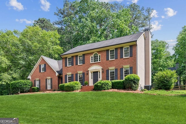 6165 Pin Oak Ln, Alpharetta, GA 30005 - view of front of house featuring a chimney, a front lawn, brick siding, and cooling unit