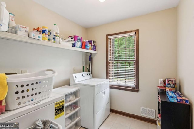 6165 Pin Oak Ln, Alpharetta, GA 30005 - washroom with washer and dryer, light tile patterned floors, and baseboards