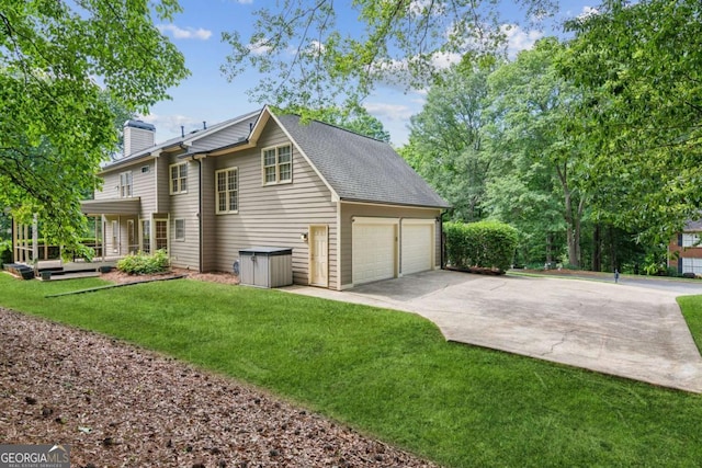 6165 Pin Oak Ln, Alpharetta, GA 30005 - view of side of home featuring a chimney, a garage, driveway, and a yard