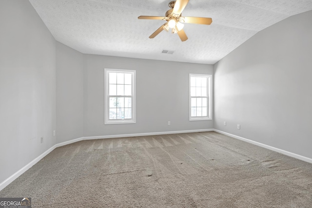 145 Silver Mine Trl, Austell, GA 30168 - spare room with a textured ceiling, healthy amount of natural light, carpet floors, a ceiling fan, and baseboards