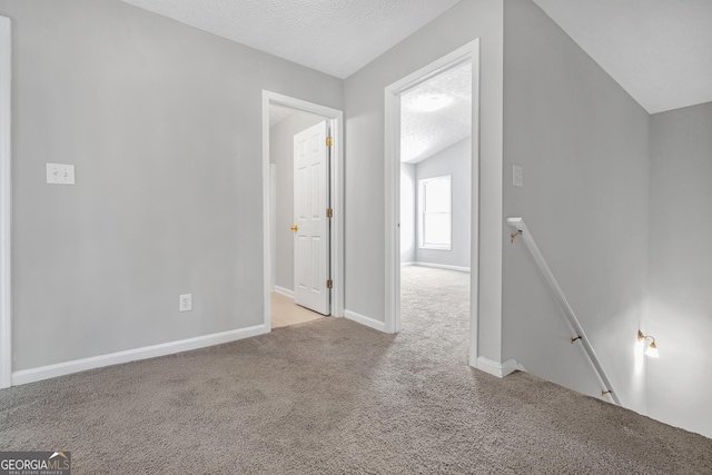 145 Silver Mine Trl, Austell, GA 30168 - carpeted empty room with baseboards and a textured ceiling