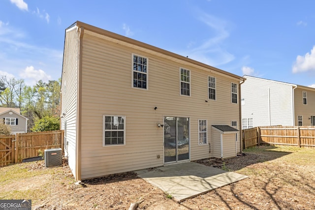 145 Silver Mine Trl, Austell, GA 30168 - back of property featuring central AC, a fenced backyard, and a patio area