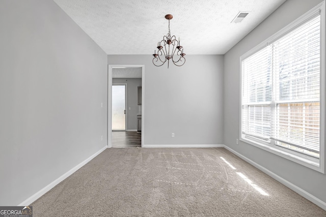 145 Silver Mine Trl, Austell, GA 30168 - unfurnished room featuring a textured ceiling, carpet flooring, a chandelier, and baseboards