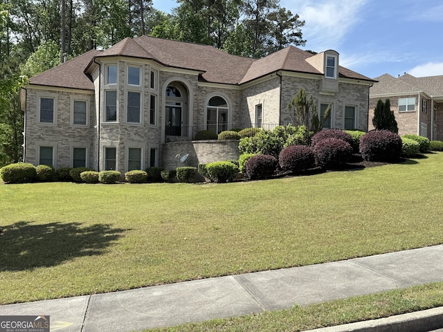 2360 Barrington Trace Cir SW, South Fulton, GA 30331 - french provincial home featuring a front lawn and stone siding