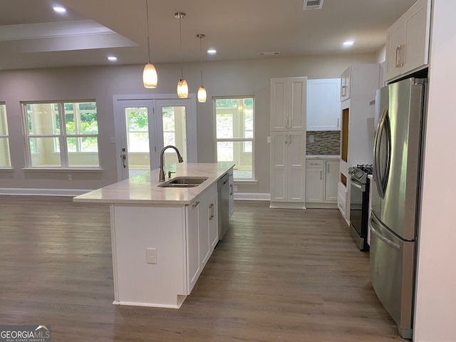 5950 Lynfield Dr, South Fulton, GA 30349 - kitchen featuring a sink, appliances with stainless steel finishes, wood finished floors, white cabinets, and recessed lighting