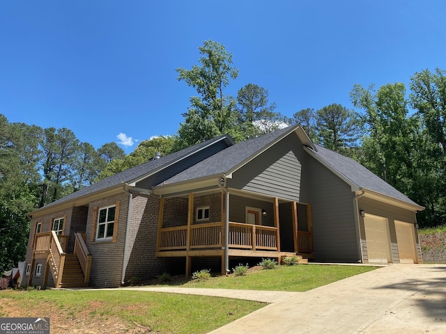 5950 Lynfield Dr, South Fulton, GA 30349 - single story home featuring an attached garage, covered porch, brick siding, driveway, and a front lawn