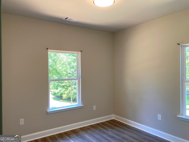 5950 Lynfield Dr, South Fulton, GA 30349 - unfurnished room featuring dark wood-type flooring and baseboards