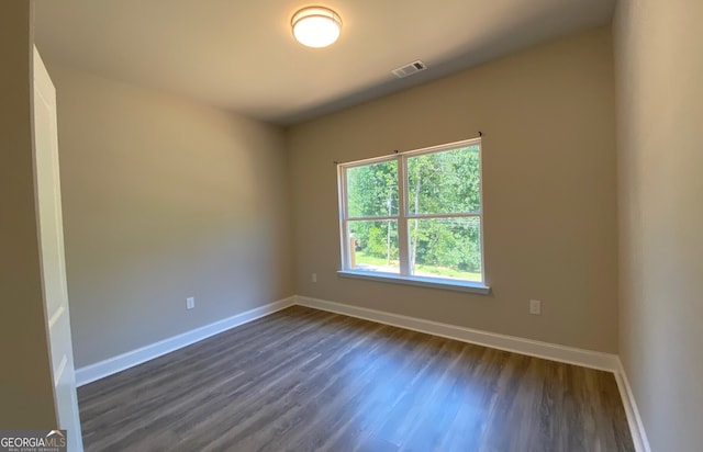 5950 Lynfield Dr, South Fulton, GA 30349 - unfurnished room with dark wood finished floors and baseboards