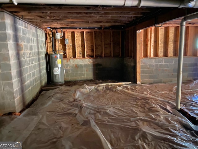 5950 Lynfield Dr, South Fulton, GA 30349 - unfinished basement featuring electric water heater