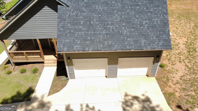 5950 Lynfield Dr, South Fulton, GA 30349 - view of front facade featuring a shingled roof, driveway, and an attached garage