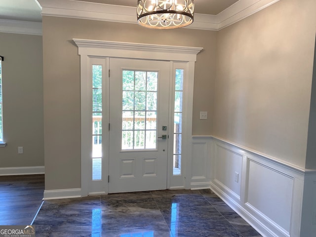 5950 Lynfield Dr, South Fulton, GA 30349 - entryway with ornamental molding, wainscoting, a decorative wall, and a chandelier