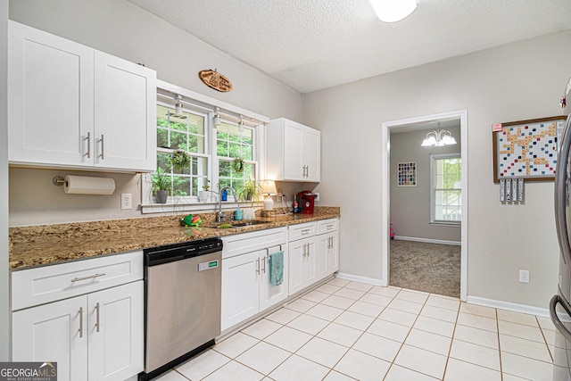 385 Eagles Nest Cir, Carrollton, GA 30116 - kitchen with dishwasher, a sink, a textured ceiling, white cabinetry, and plenty of natural light