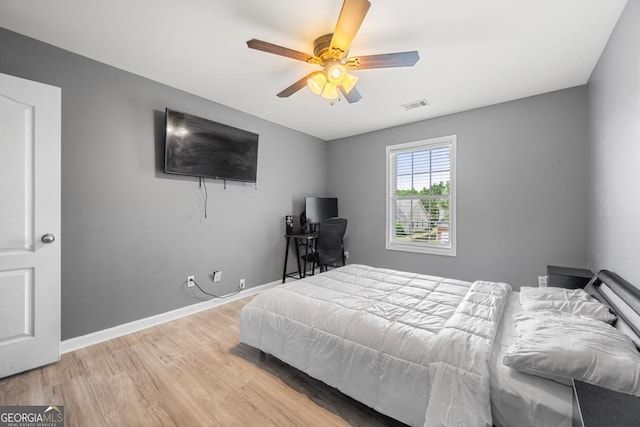 143 Monarch Way, Hiram, GA 30141 - bedroom with light wood finished floors, baseboards, and a ceiling fan