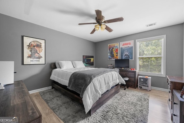 143 Monarch Way, Hiram, GA 30141 - bedroom with light wood finished floors, baseboards, and a ceiling fan