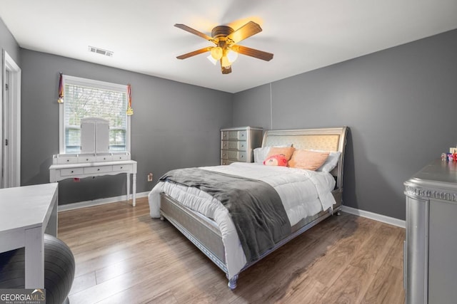 143 Monarch Way, Hiram, GA 30141 - bedroom with wood finished floors, baseboards, and a ceiling fan