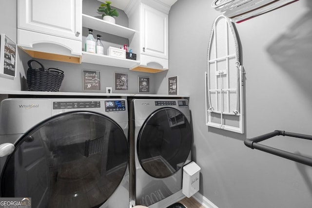 143 Monarch Way, Hiram, GA 30141 - laundry area with washing machine and clothes dryer, cabinet space, and baseboards