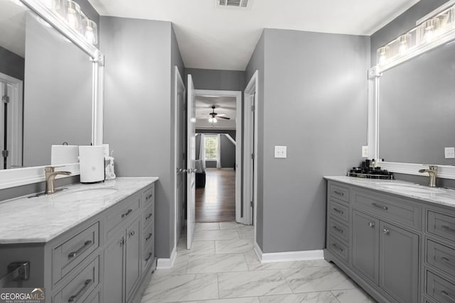 143 Monarch Way, Hiram, GA 30141 - bathroom featuring marble finish floors, ceiling fan, two vanities, and baseboards