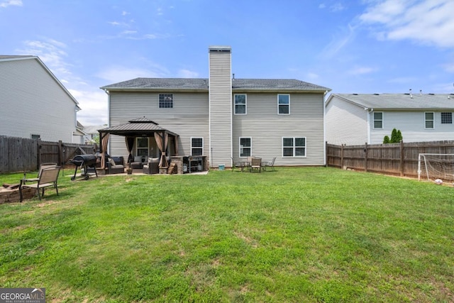 143 Monarch Way, Hiram, GA 30141 - back of property with a gazebo, a chimney, an outdoor living space with a fire pit, and a patio area