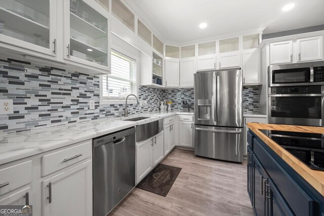 143 Monarch Way, Hiram, GA 30141 - kitchen featuring appliances with stainless steel finishes, white cabinets, wood counters, backsplash, and recessed lighting