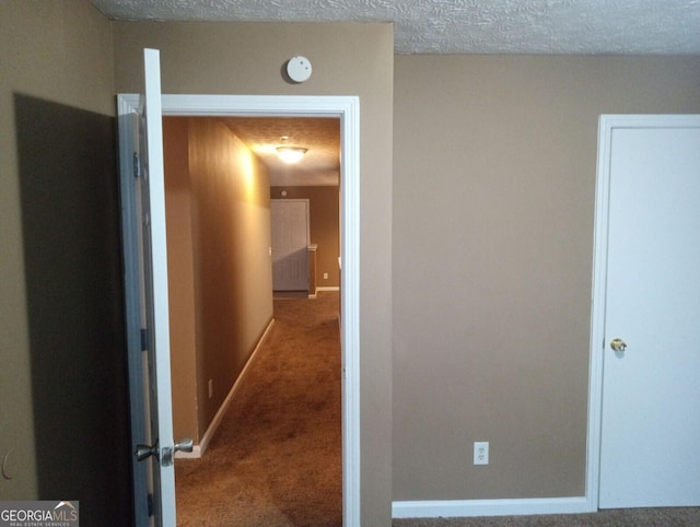 8202 Fairington Village Dr, Lithonia, GA 30038 - corridor with carpet floors, baseboards, and a textured ceiling