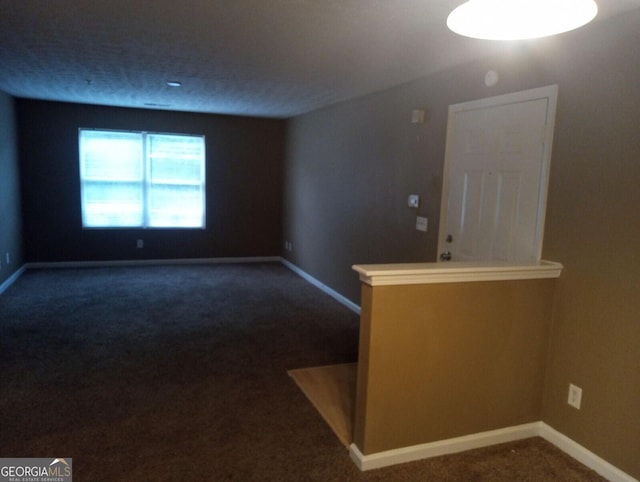 8202 Fairington Village Dr, Lithonia, GA 30038 - unfurnished room with dark colored carpet and baseboards