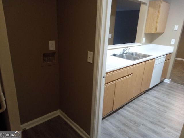8202 Fairington Village Dr, Lithonia, GA 30038 - kitchen featuring a sink, dishwasher, light brown cabinetry, light countertops, and baseboards