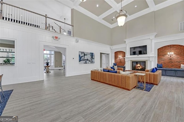 6206 Carriage Gate Ln Unit 6, Mableton, GA 30126 - living area with a high ceiling, wood finished floors, coffered ceiling, a glass covered fireplace, and beam ceiling