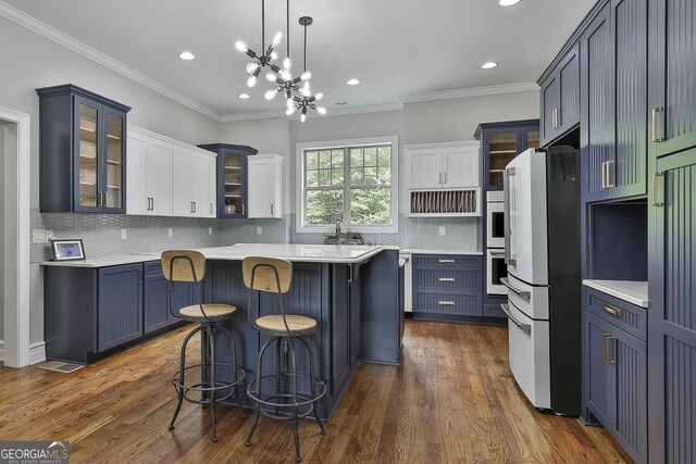 210 Short Rd, Sharpsburg, GA 30277 - kitchen featuring freestanding refrigerator, recessed lighting, light countertops, decorative backsplash, and glass insert cabinets