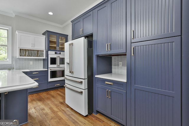 210 Short Rd, Sharpsburg, GA 30277 - kitchen with white appliances, ornamental molding, light wood finished floors, light countertops, and glass insert cabinets