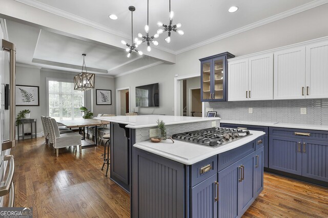 210 Short Rd, Sharpsburg, GA 30277 - kitchen featuring a chandelier, stainless steel gas stovetop, blue cabinetry, dark wood-style floors, and light countertops