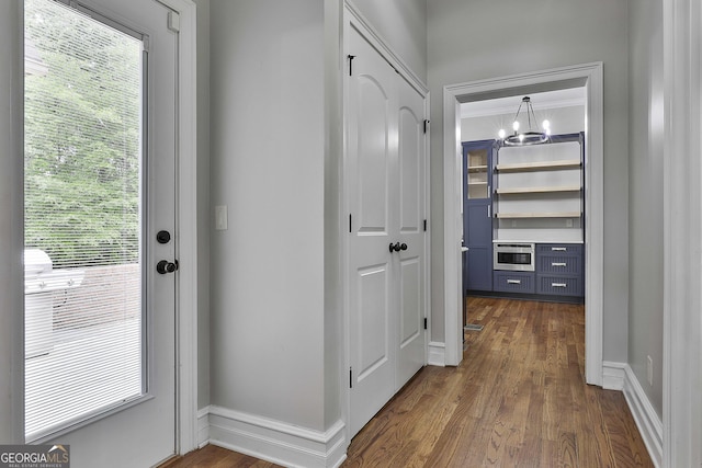 210 Short Rd, Sharpsburg, GA 30277 - entryway featuring dark wood-style flooring, a chandelier, and baseboards
