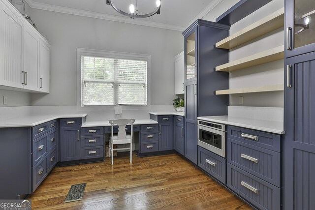 210 Short Rd, Sharpsburg, GA 30277 - kitchen with blue cabinets, ornamental molding, open shelves, white cabinetry, and light countertops