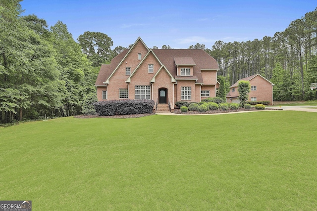 210 Short Rd, Sharpsburg, GA 30277 - traditional-style house featuring a front yard and brick siding