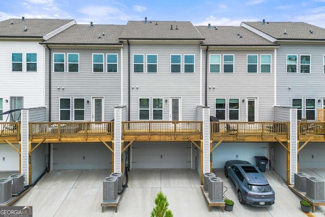 1172 Edwin Ln, Sugar Hill, GA 30518 - rear view of house featuring a garage and driveway