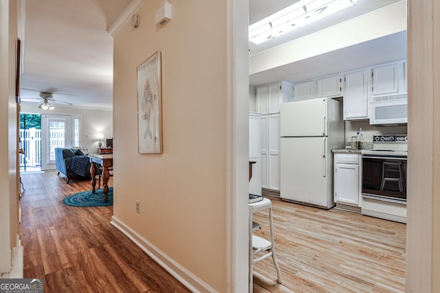 1750 Clairmont Rd Unit 35, Decatur, GA 30033 - hall featuring crown molding, light wood-style flooring, and baseboards