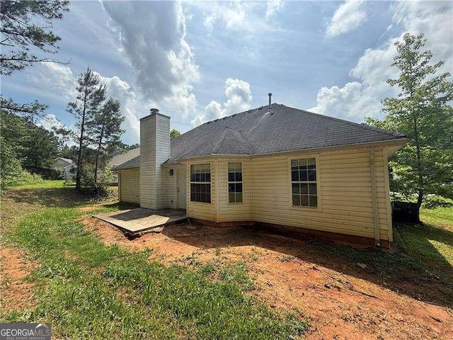 160 Goldleaf Dr, Hampton, GA 30228 - rear view of house with a chimney