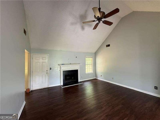 160 Goldleaf Dr, Hampton, GA 30228 - unfurnished living room with ceiling fan, wood finished floors, baseboards, high vaulted ceiling, and a fireplace with raised hearth