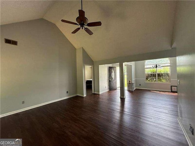 160 Goldleaf Dr, Hampton, GA 30228 - unfurnished living room featuring ceiling fan, wood finished floors, baseboards, and high vaulted ceiling