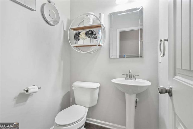 200 Cherokee Reserve Cir, Canton, GA 30115 - half bathroom with toilet, baseboards, and a sink
