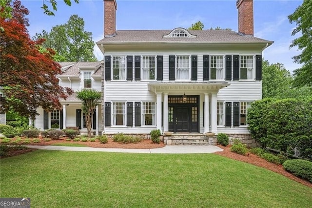 4356 N Buckhead Dr NE, Atlanta, GA 30342 - view of front of home with a chimney and a front lawn