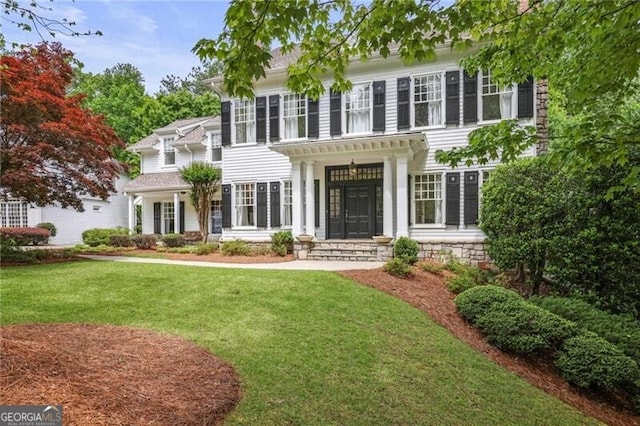 4356 N Buckhead Dr NE, Atlanta, GA 30342 - colonial home featuring a front lawn