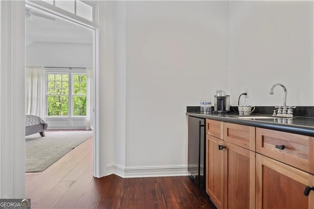 4356 N Buckhead Dr NE, Atlanta, GA 30342 - indoor wet bar with dark wood finished floors and dishwasher