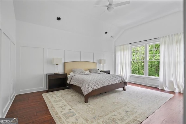 4356 N Buckhead Dr NE, Atlanta, GA 30342 - bedroom featuring vaulted ceiling, dark wood-style floors, a decorative wall, and a ceiling fan