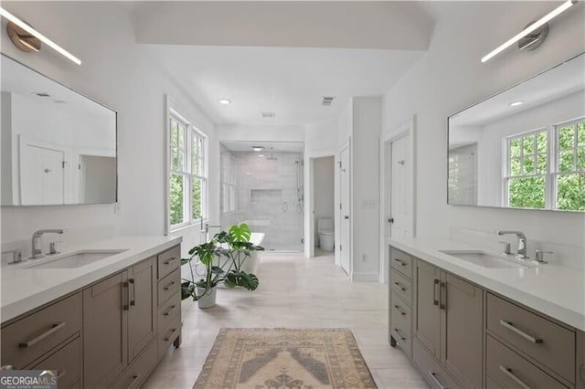 4356 N Buckhead Dr NE, Atlanta, GA 30342 - bathroom featuring two vanities, a shower stall, and recessed lighting