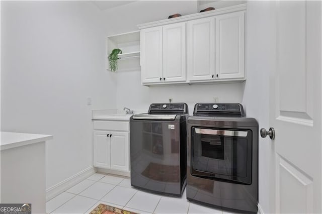 4356 N Buckhead Dr NE, Atlanta, GA 30342 - washroom with cabinet space, independent washer and dryer, and light tile patterned floors