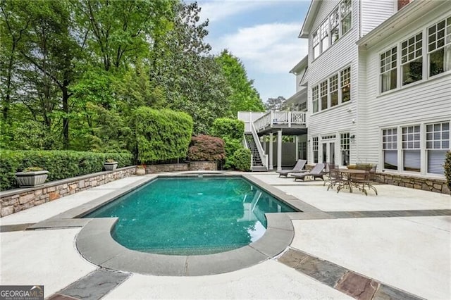 4356 N Buckhead Dr NE, Atlanta, GA 30342 - outdoor pool featuring stairs, a wooden deck, and a patio area