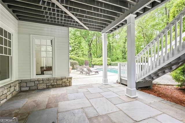 4356 N Buckhead Dr NE, Atlanta, GA 30342 - view of patio / terrace featuring stairway and an outdoor pool
